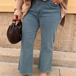 Teal acid wash high-waisted bootcut jeans with frayed hem