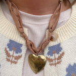 Tan scarf-style necklace with hammered gold heart pendant, handmade by Hart Designs.