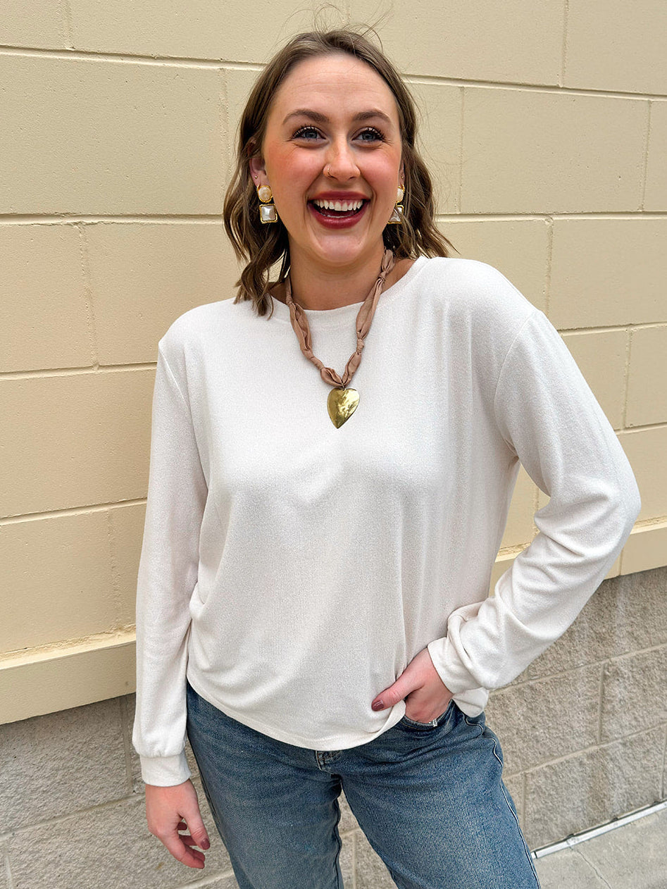 Sand beige long sleeve tee with round neck and cinched wrists