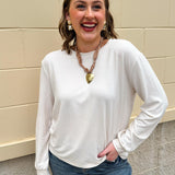 Sand beige long sleeve tee with round neck and cinched wrists