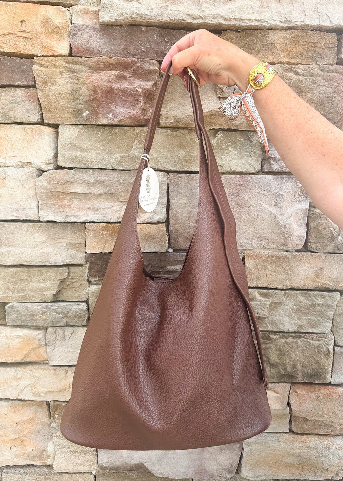 Chocolate slouchy hobo bag with double front zippers and gold hardware