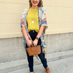 Vacay on the Mind Mandala Kimono with vibrant mandala, paisley, and floral prints, featuring open slits and lightweight flowy fabric.