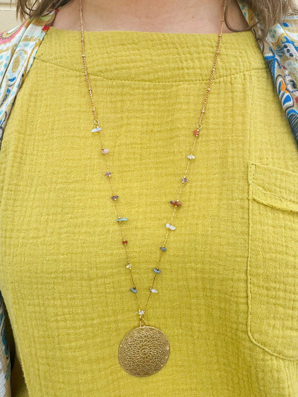 Multi Stone Gold Plated Filigree Pendant Necklace with 1.58" multicolored semi-precious stone pendant and long gold-plated chain.