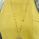 Multi Stone Gold Plated Filigree Pendant Necklace with 1.58" multicolored semi-precious stone pendant and long gold-plated chain.