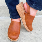 Corky’s Low Temps Rust Clogs with cork wedge, vegan leather upper, closed toe, and ankle strap.