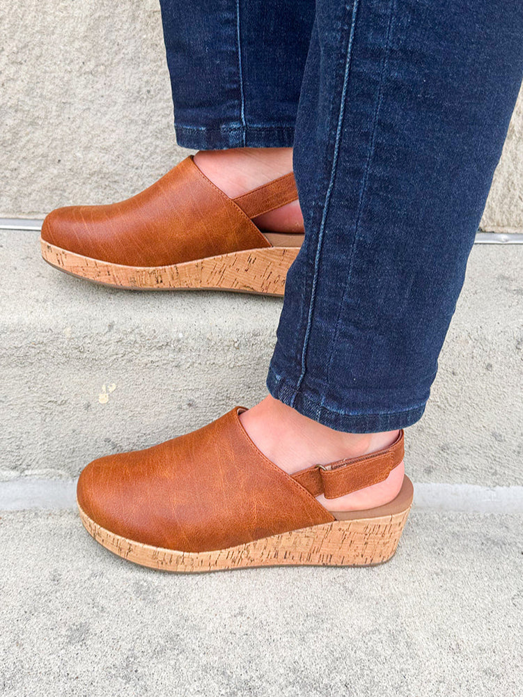 Corky’s Low Temps Rust Clogs with cork wedge, vegan leather upper, closed toe, and ankle strap.