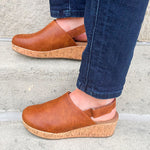 Corky’s Low Temps Rust Clogs with cork wedge, vegan leather upper, closed toe, and ankle strap.