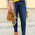 High-waisted dark wash boyfriend jeans with a relaxed fit, styled uncuffed