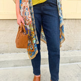 High-waisted dark wash boyfriend jeans with a relaxed fit, styled uncuffed