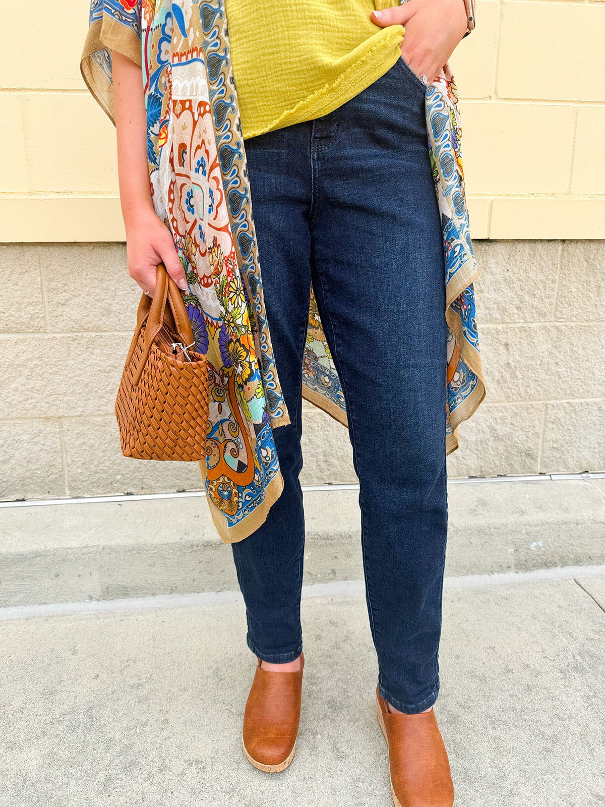High-waisted dark wash boyfriend jeans with a relaxed fit, styled uncuffed