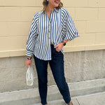 Lightweight striped button-down top in midnight blue and cream with ¾ pirate sleeves, styled for a casual coastal look