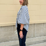 Lightweight striped button-down top in midnight blue and cream with ¾ pirate sleeves, styled for a casual coastal look