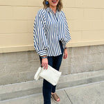 Lightweight striped button-down top in midnight blue and cream with ¾ pirate sleeves, styled for a casual coastal look
