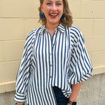 Lightweight striped button-down top in midnight blue and cream with ¾ pirate sleeves, styled for a casual coastal look