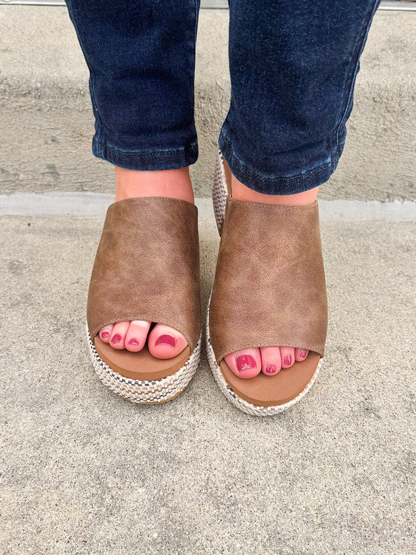 Bronze vegan leather wedge with peep toe, slide-in block heel, and multicolored cork sole