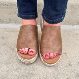 Bronze vegan leather wedge with peep toe, slide-in block heel, and multicolored cork sole