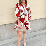 Rust and cream tie-neck mini dress with voluminous sleeves and banded cuffs