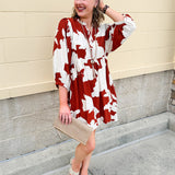 Rust and cream tie-neck mini dress with voluminous sleeves and banded cuffs