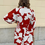 Rust and cream tie-neck mini dress with voluminous sleeves and banded cuffs