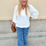 Medium wash wide-leg denim palazzo pants with chenille flower embroidery