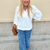 Medium wash wide-leg denim palazzo pants with chenille flower embroidery