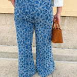 Medium wash wide-leg denim palazzo pants with chenille flower embroidery