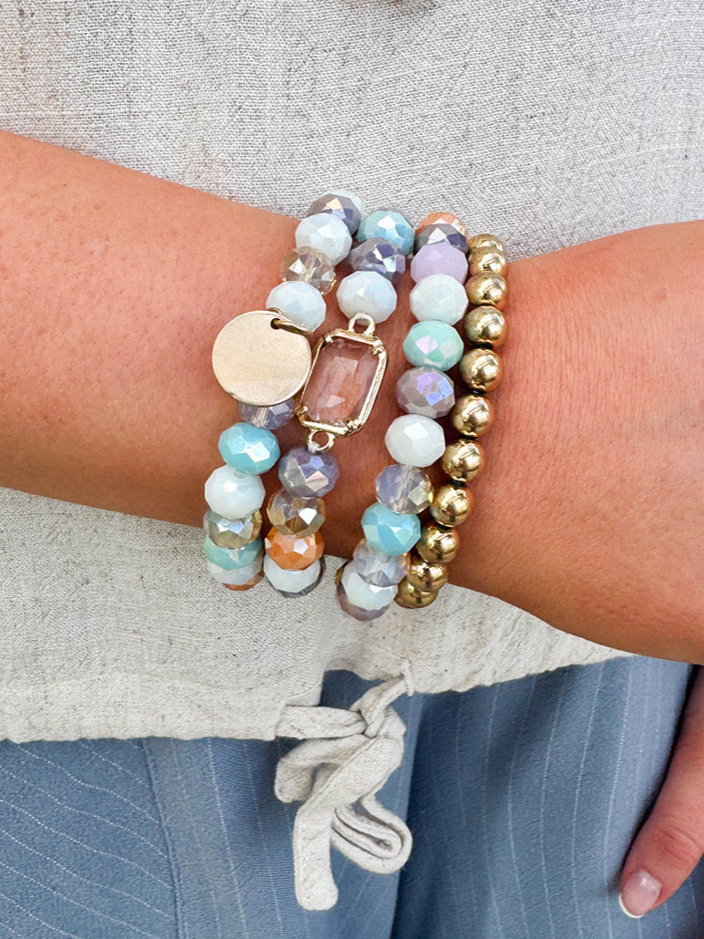 Lainey Mixed Beads 4 Row Stretch Bracelet Set featuring four beaded bracelets in various colors.