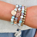 Lainey Mixed Beads 4 Row Stretch Bracelet Set featuring four beaded bracelets in various colors.