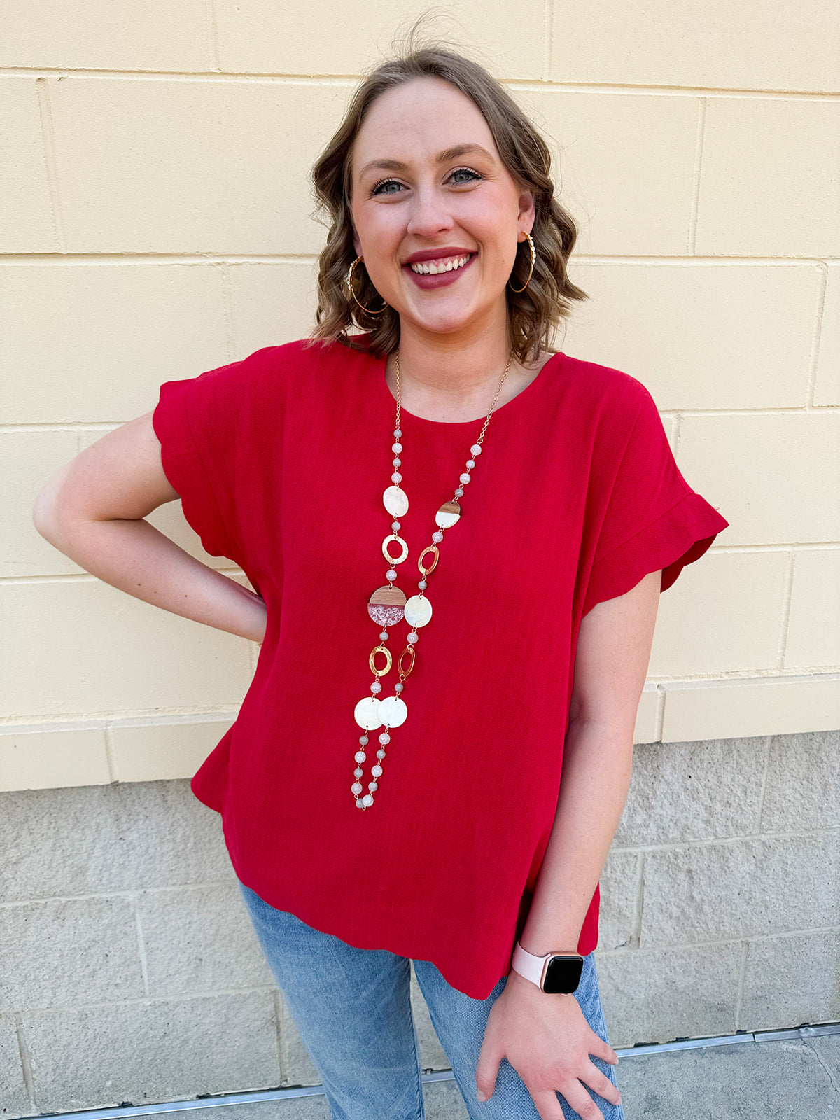 Model wearing the United and Chic Scalloped Hemmed Linen Top featuring a round neckline, scalloped sleeves, and hem – styled for a breezy, feminine summer look in lightweight linen blend fabric.
