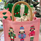 Holiday-themed swag bag with assorted cozy and festive items.