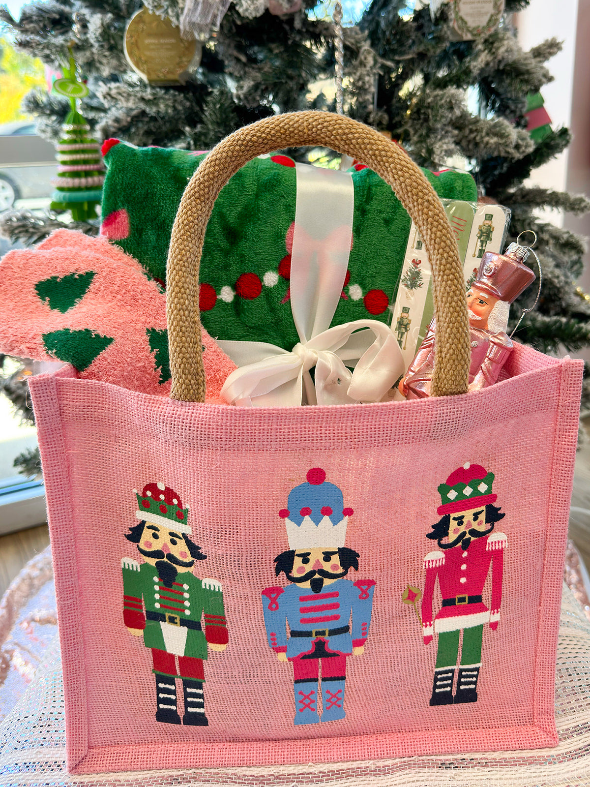 Holiday-themed swag bag with assorted cozy and festive items.