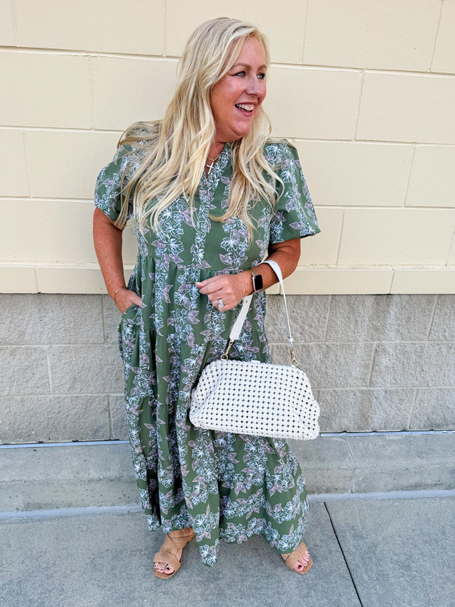 Green midi dress with white and pink floral print and short sleeves