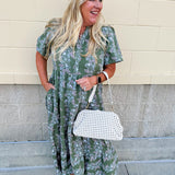 Green midi dress with white and pink floral print and short sleeves