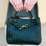 Forest green woven crossbody bag with gold hardware
