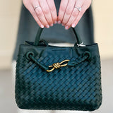 Forest green woven crossbody bag with gold hardware