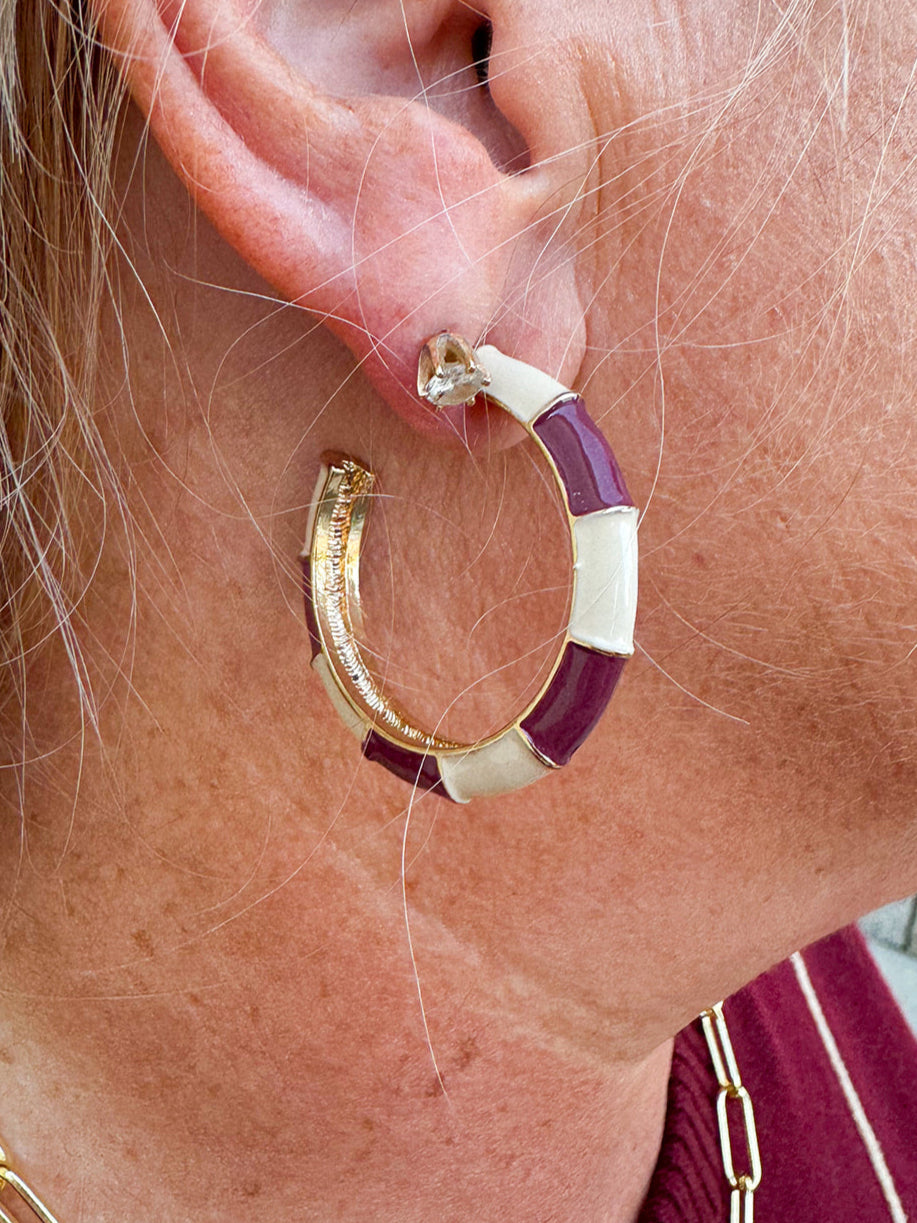 Garnet and gold enamel earrings with gold accents, available in three sizes.