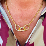 Gold-toned necklace with three statement chain links on a delicate rope chain—elegant, timeless, and made to last.