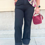 Black high-rise wide-leg jeans with cuffed hems