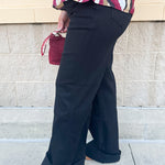 Black high-rise wide-leg jeans with cuffed hems