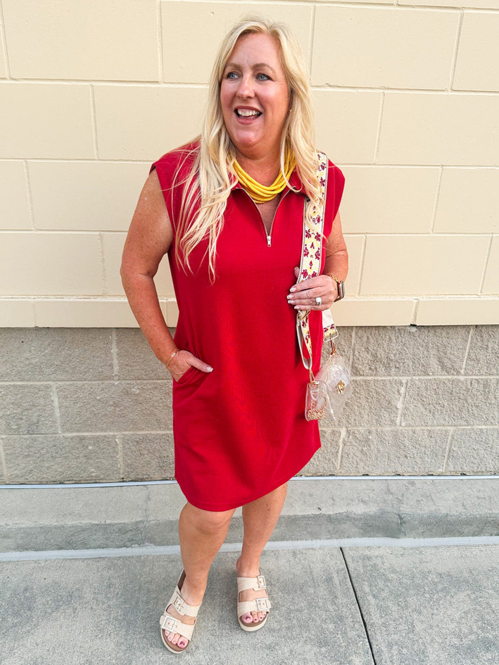 Garnet sleeveless knit polo mini dress with half zip and pockets