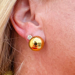 Gold button stud earrings with a mirror-like finish.