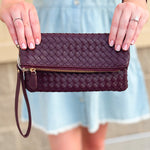 Merlot clutch with gold hardware and wrist strap