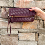 Merlot clutch with gold hardware and wrist strap