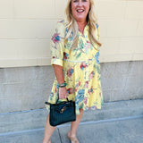 Butter yellow mini shirt dress with button-down front, collar, ¾ sleeves, and striped piping details.