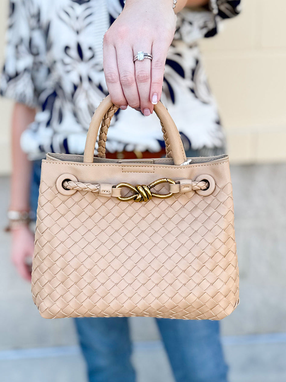 Beige woven handbag with gold accents 