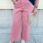 Women’s cropped wide-leg jeans in a terracotta color with a raw cut hem