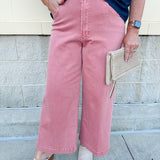 Women’s cropped wide-leg jeans in a terracotta color with a raw cut hem