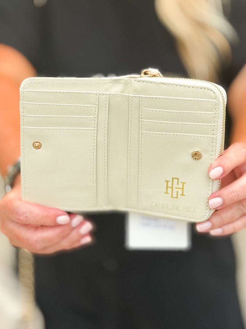 Pearl quilted vegan leather wallet with magnetic closure and zippered back compartment—compact, elegant, and practical.