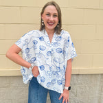 White oversized cotton top with navy seashell embroidery and drop shoulder design