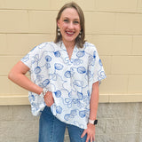 White oversized cotton top with navy seashell embroidery and drop shoulder design